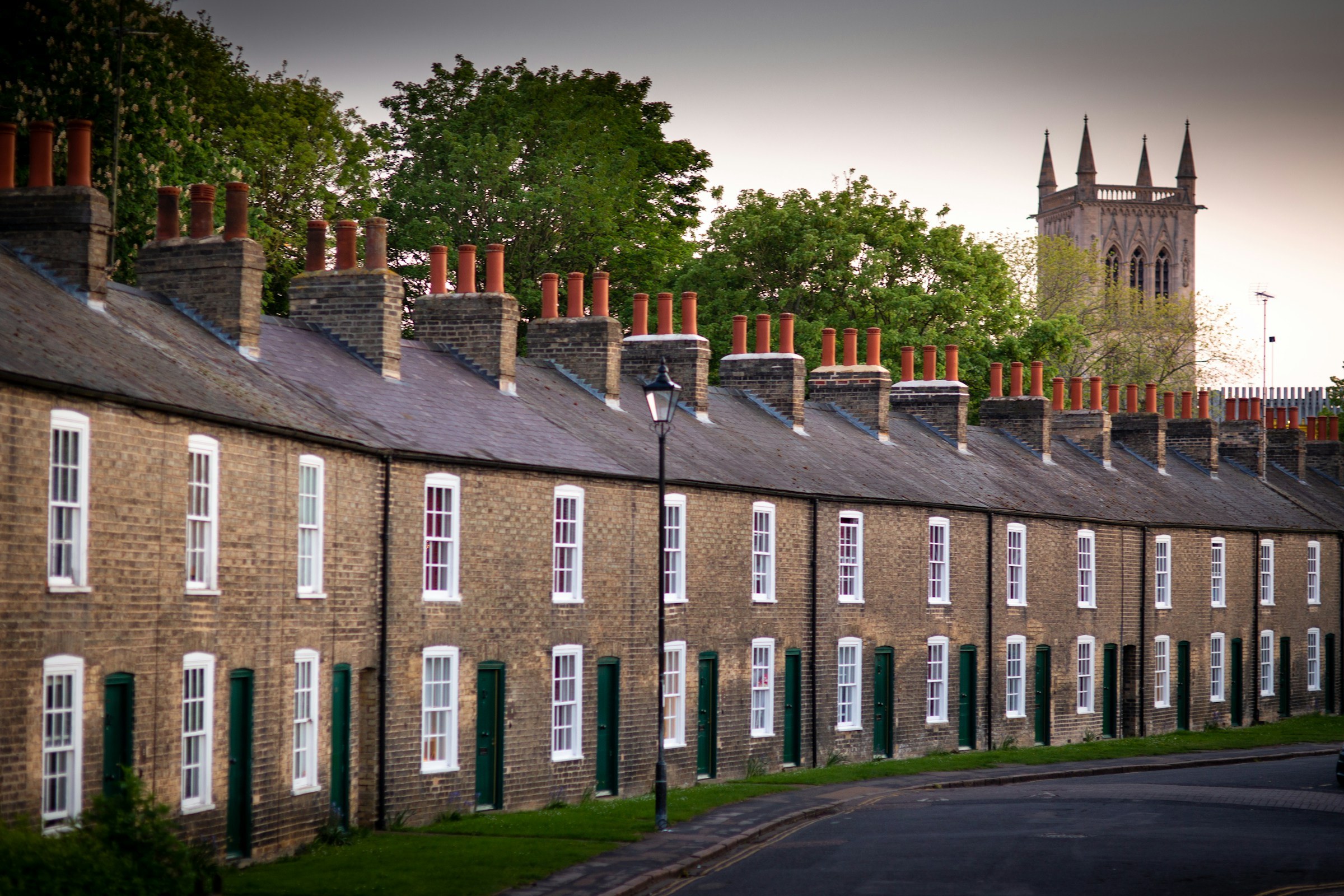 Row of stone terraced houses with chimney stacks