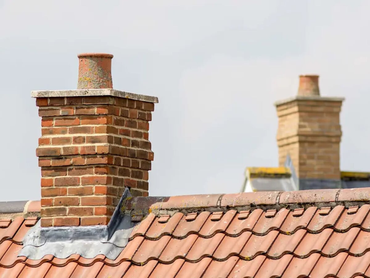 Brick chimney stack being repointed with fresh mortar