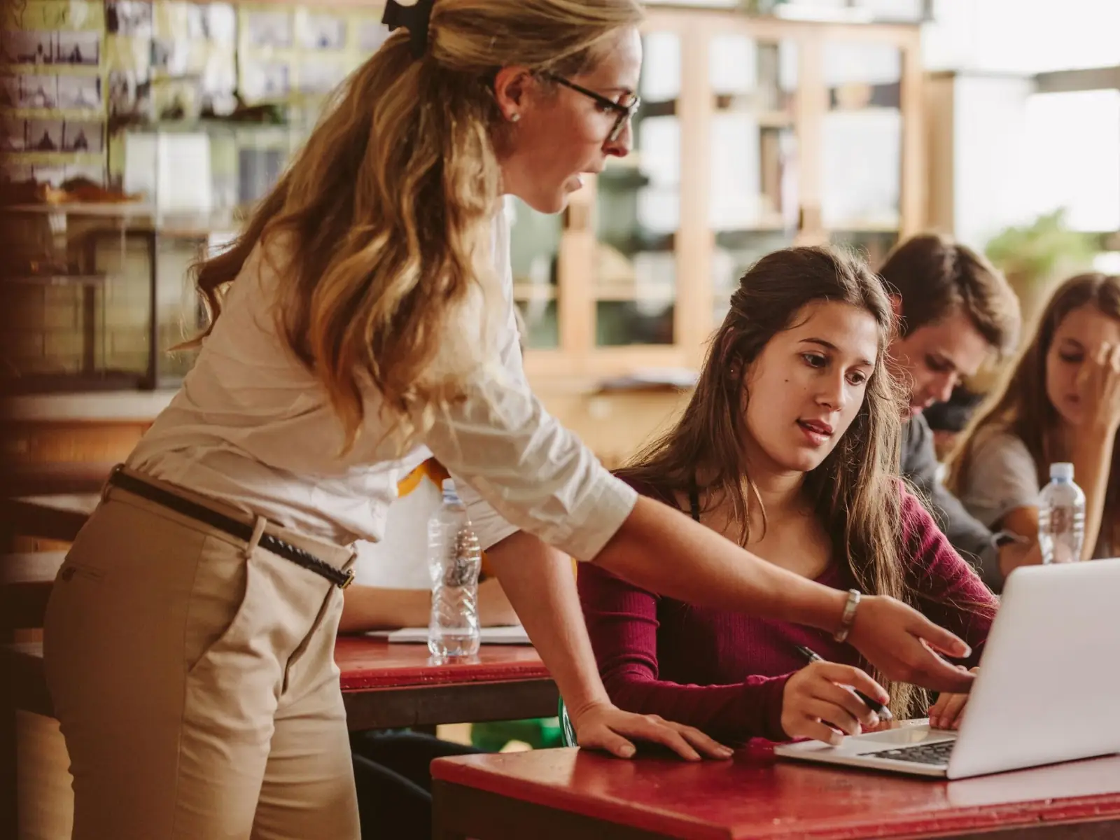 Confident teacher using technology professionally