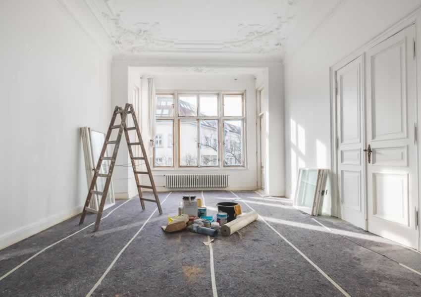 Professional painter at work in period property