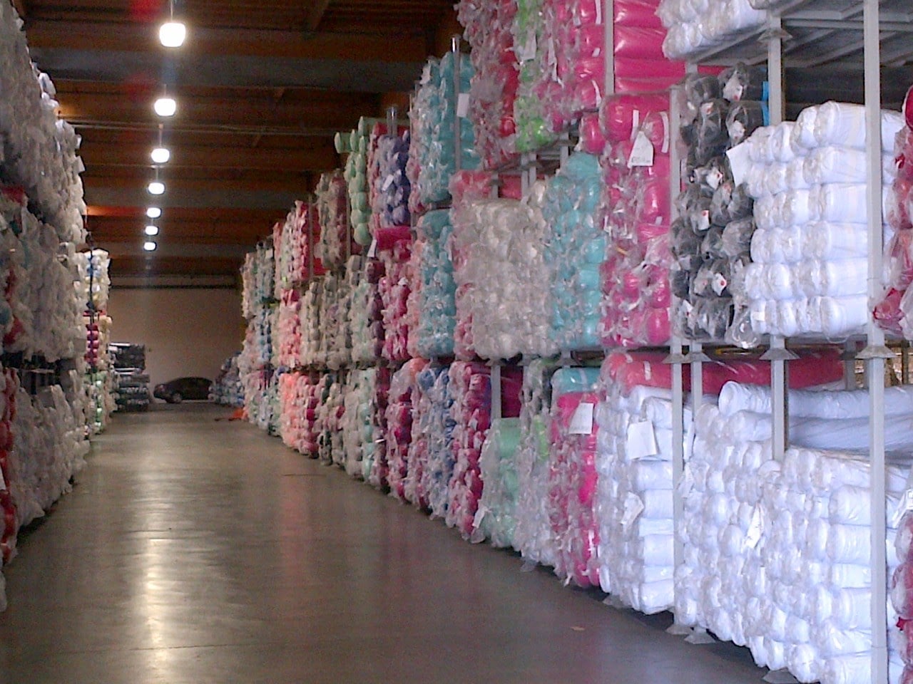 Textile rolls organized on industrial storage racks
