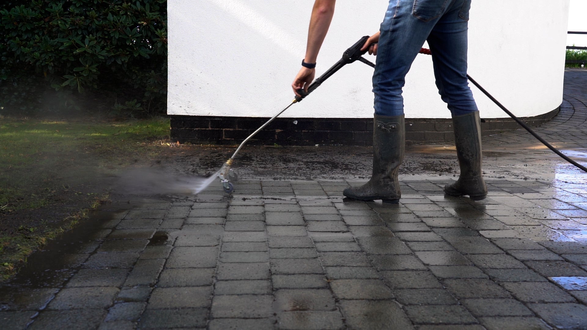 Pressure washing a residential driveway