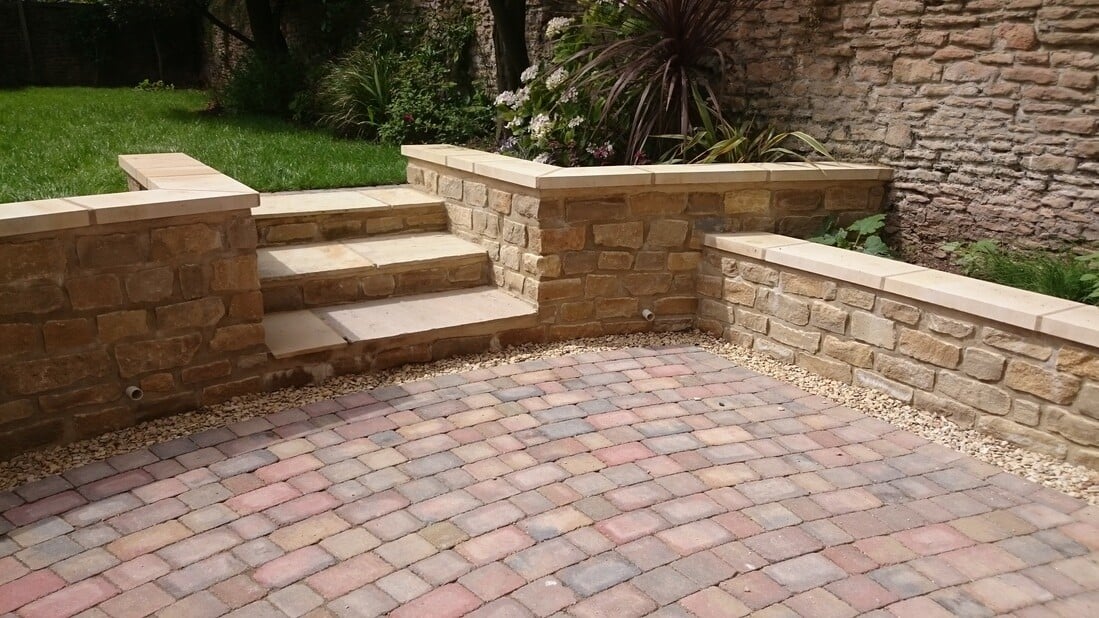 Brick retaining wall with garden steps