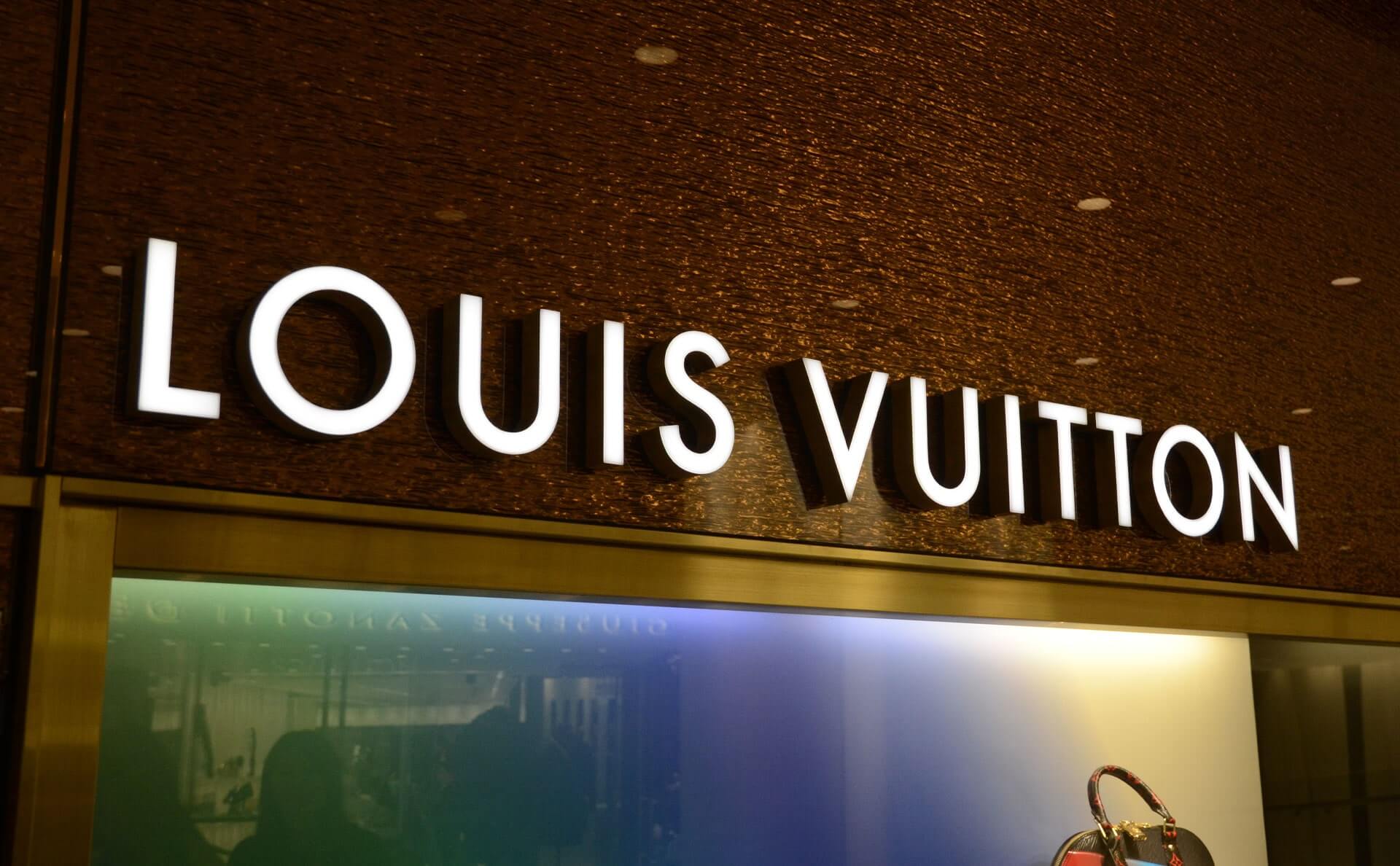 Professional LED channel letters illuminated on storefront at night