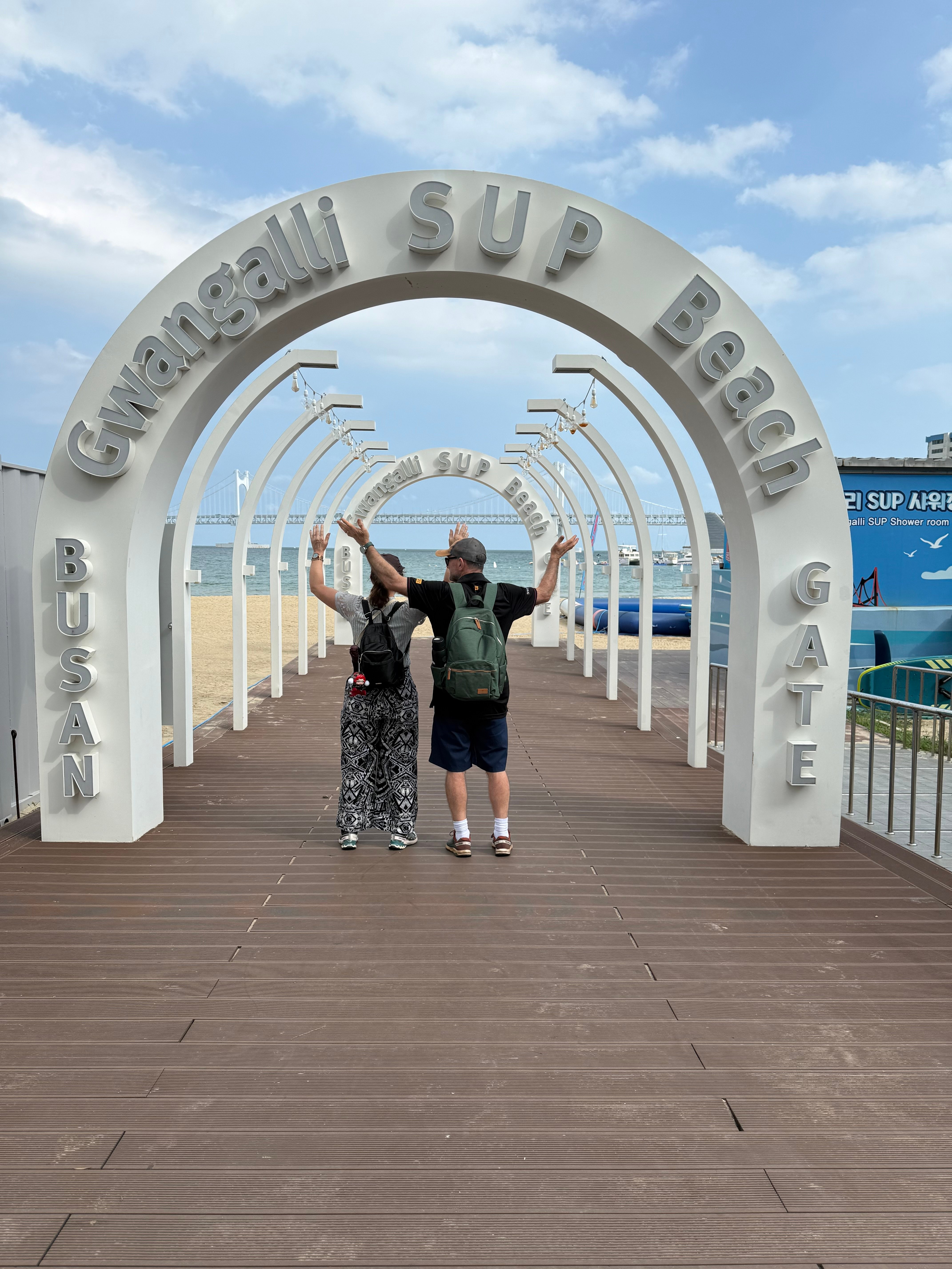 Chris and Carol celebrating at Gwangalli SUP Beach in Busan, South Korea