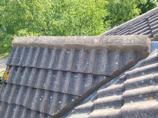 Damaged mortar ridge tiles needing replacement