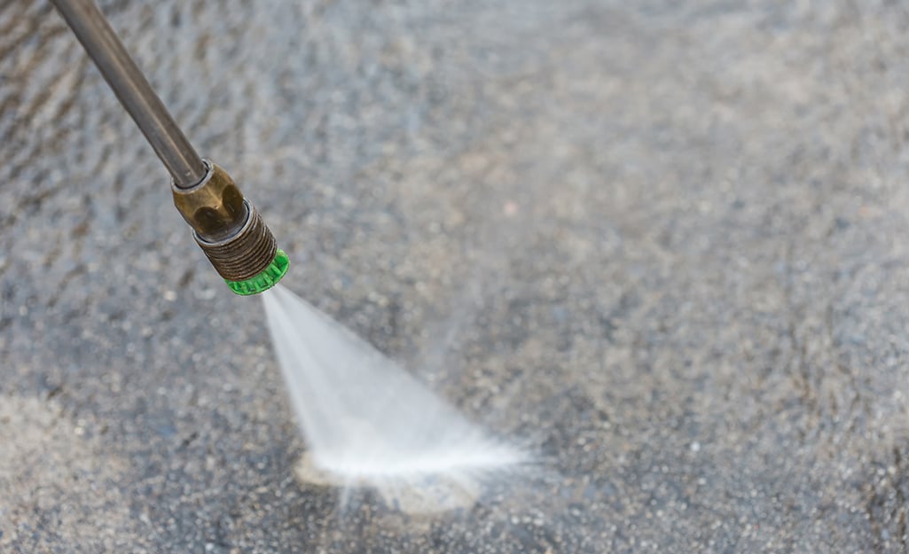 Professional pressure washing a driveway in Sacramento
