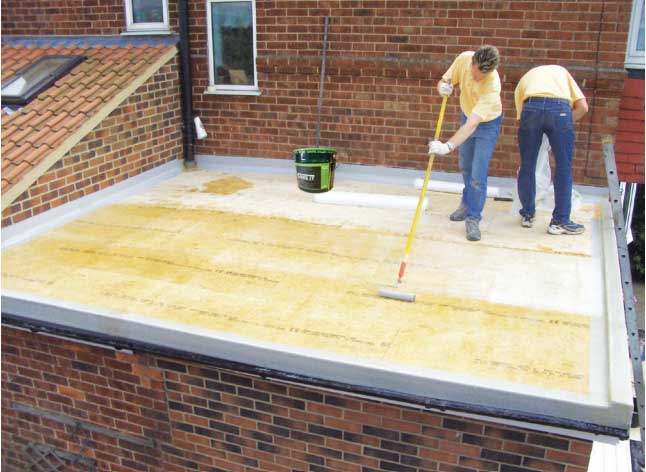 GRP fibreglass flat roof being laid
