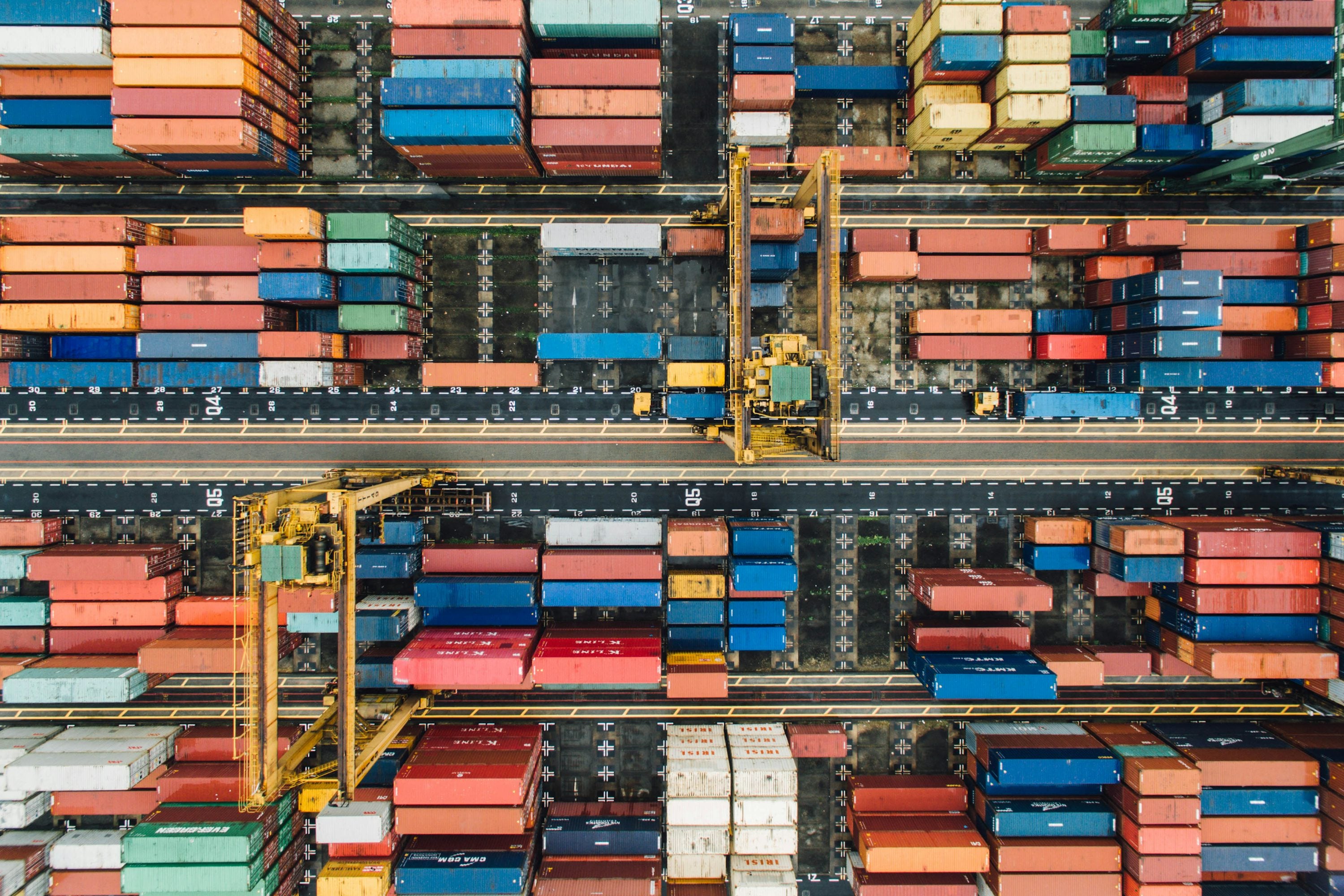 Colorful shipping containers stacked at an international port