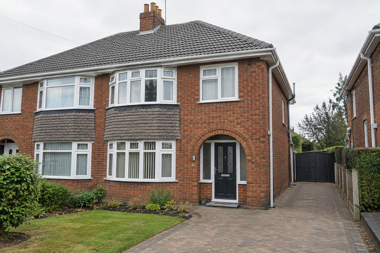 1930s semi-detached UK house with a newly tiled roof