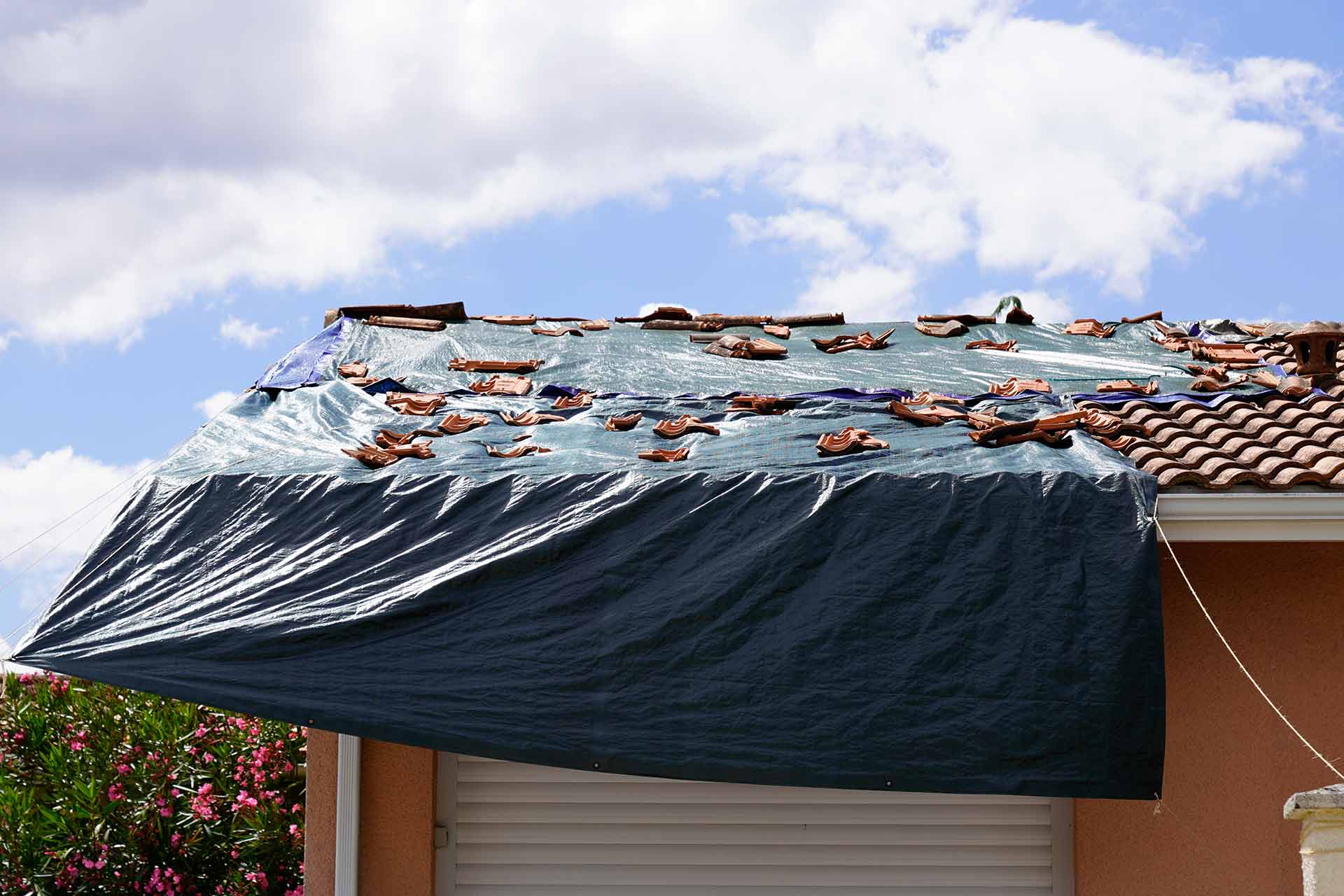 Emergency roof repair with protective covering