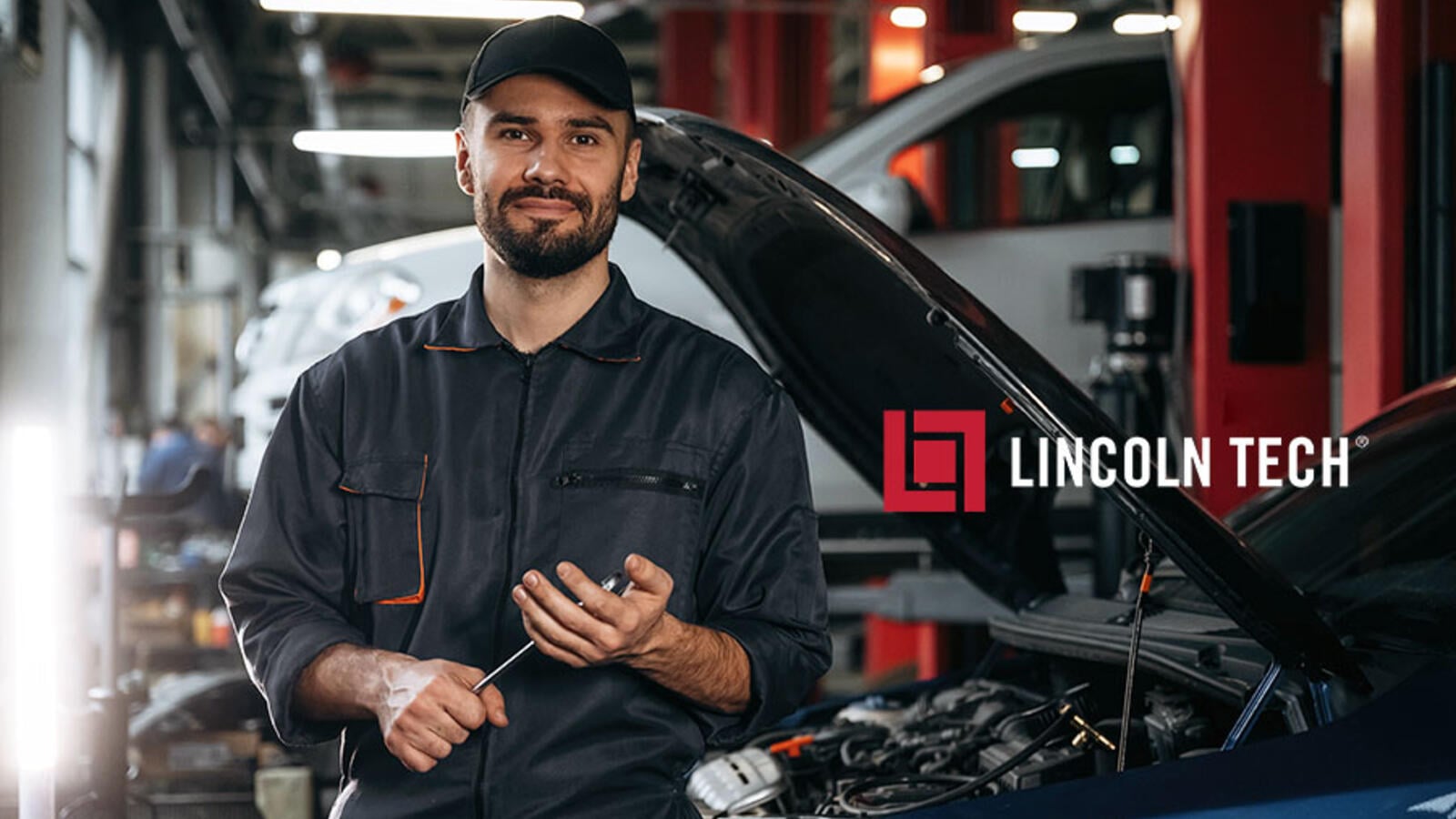 Professional auto body repair team working in a modern shop