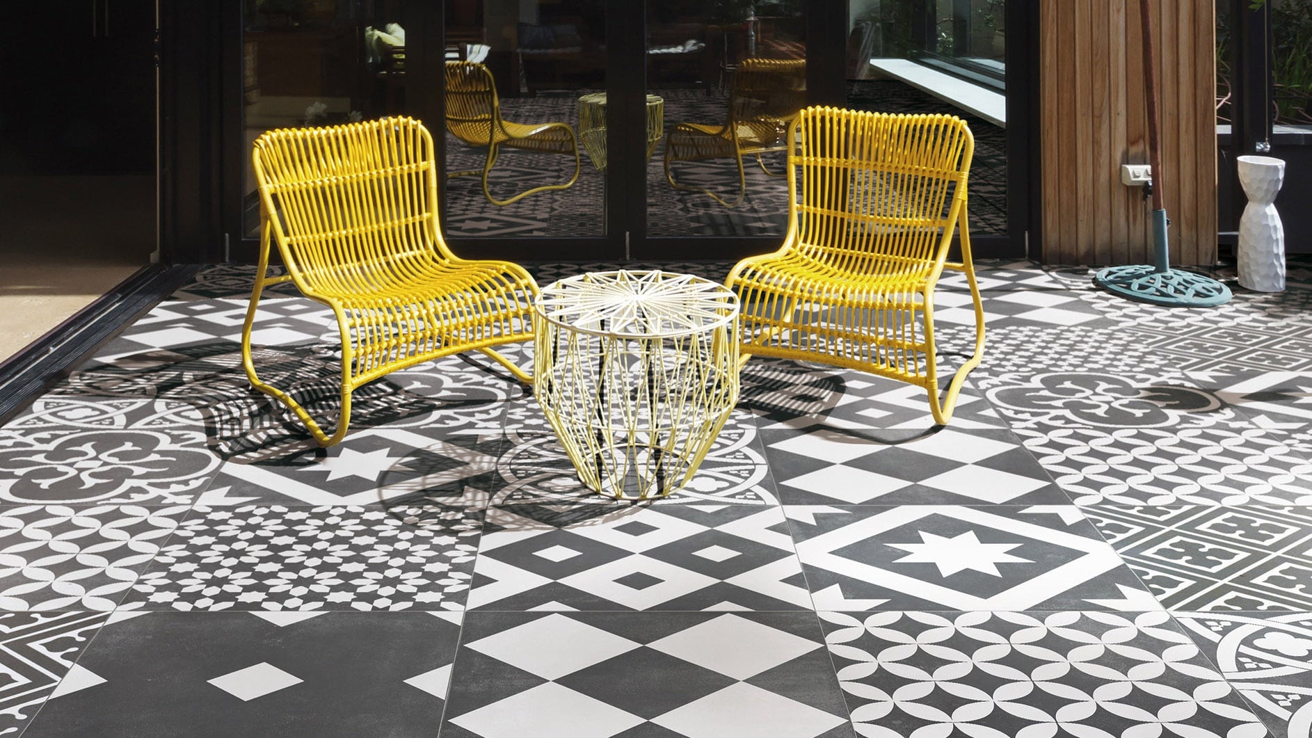 Modern porcelain tiled patio with outdoor dining area