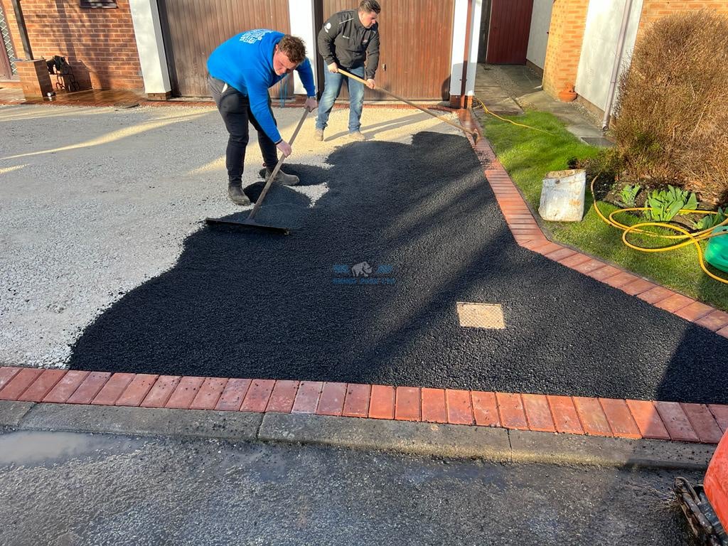 Tarmac driveway with red block border