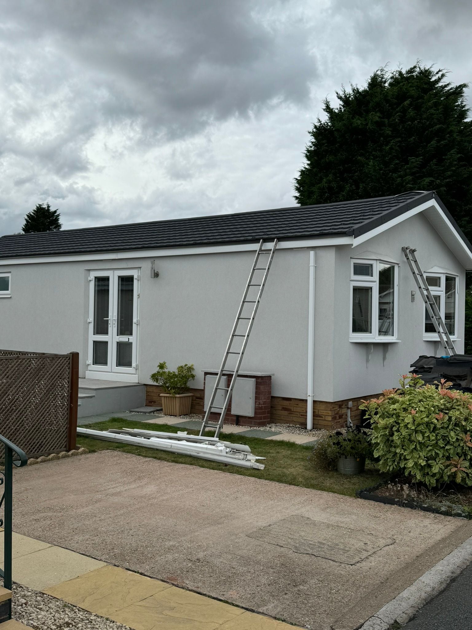 Park home refurbishment showing new cladding installation on side wall