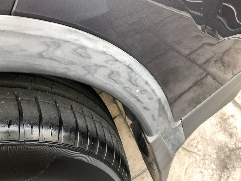 Example: sun-bleached, faded automotive plastic trim (close-up)