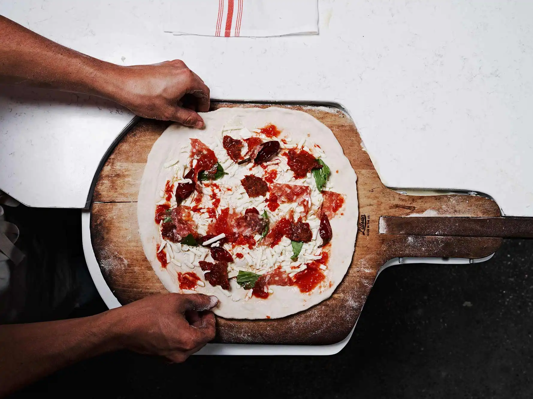 Rolling Flame Pizzeria - Hand-stretched authentic Neapolitan pizza dough