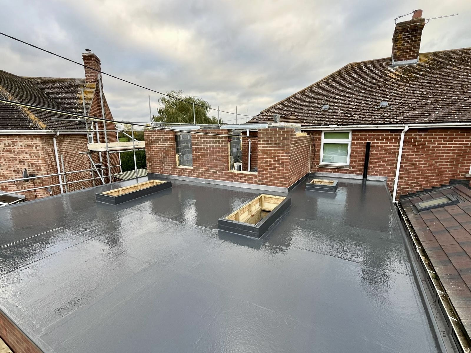 Flat roof installation with GRP fibreglass system, East London