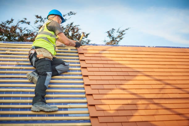 Roofer working on scaffolding