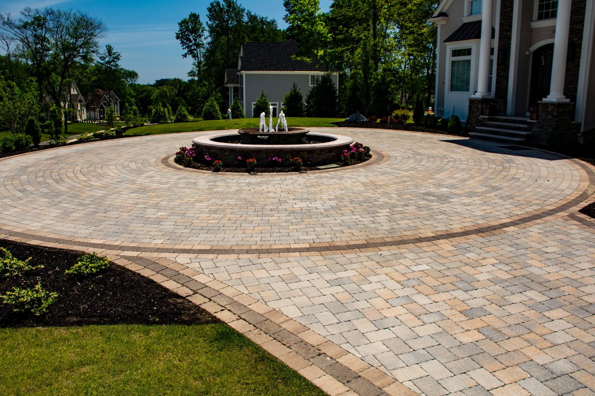 Circular pattern paver driveway installation in Tampa FL