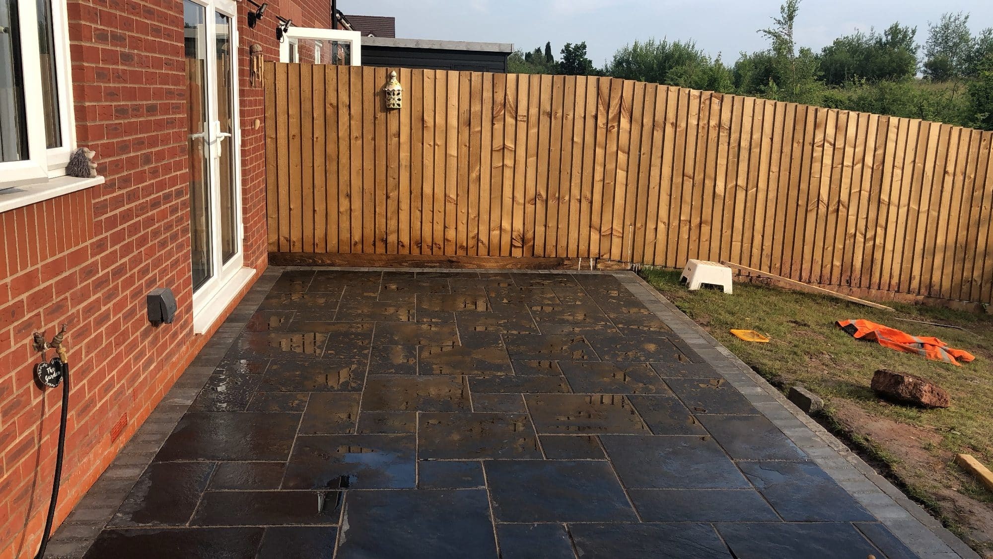 Red block paving with charcoal edging