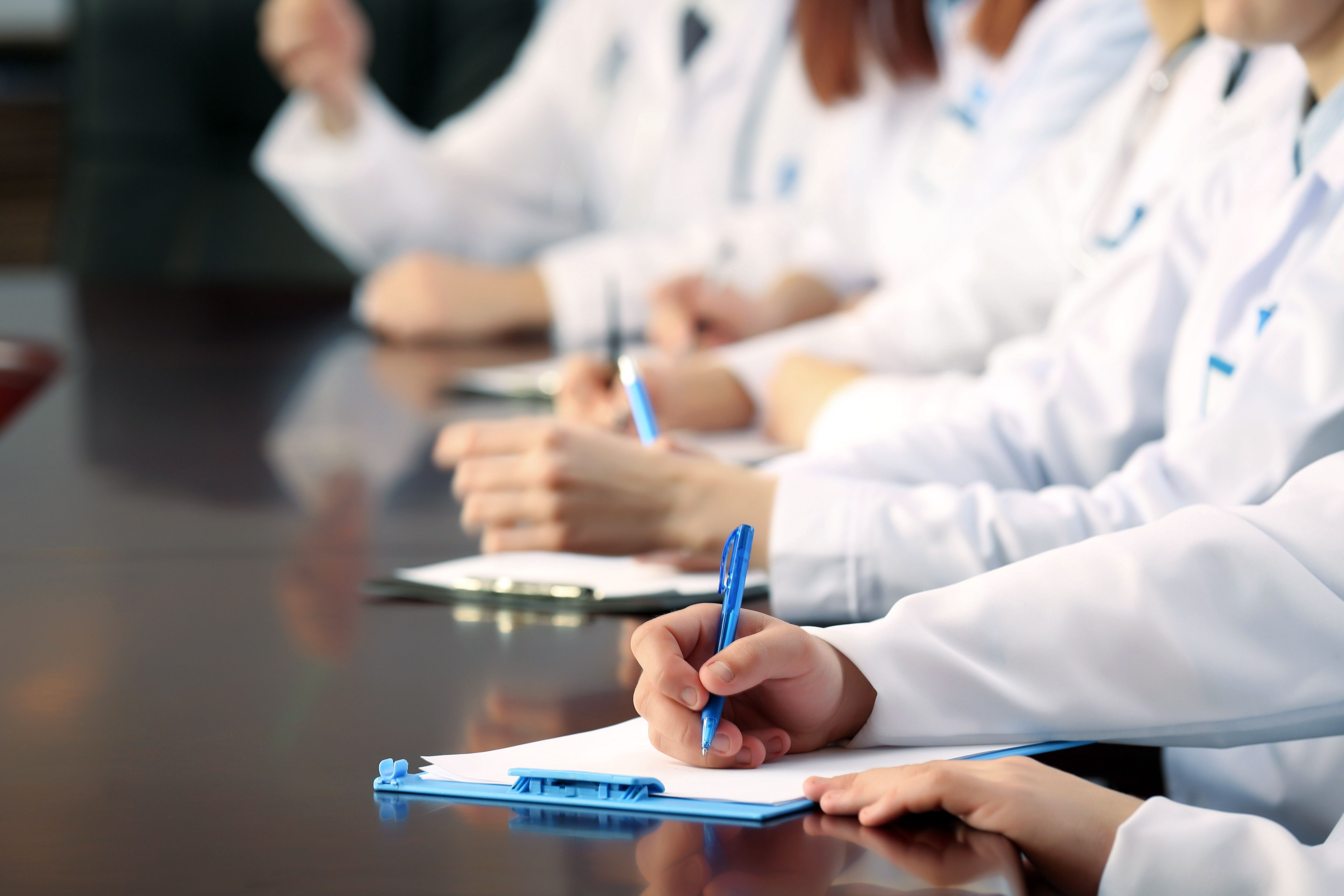 Pharmaceutical professionals in a meeting discussing market strategies