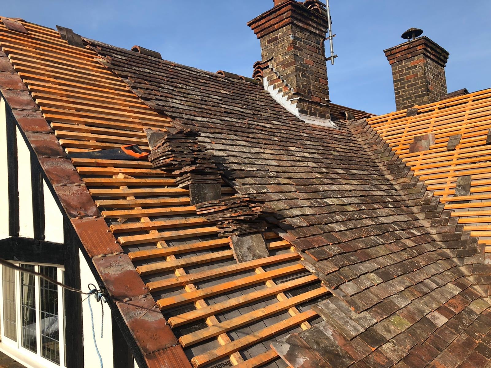 Broken roof tiles on UK house
