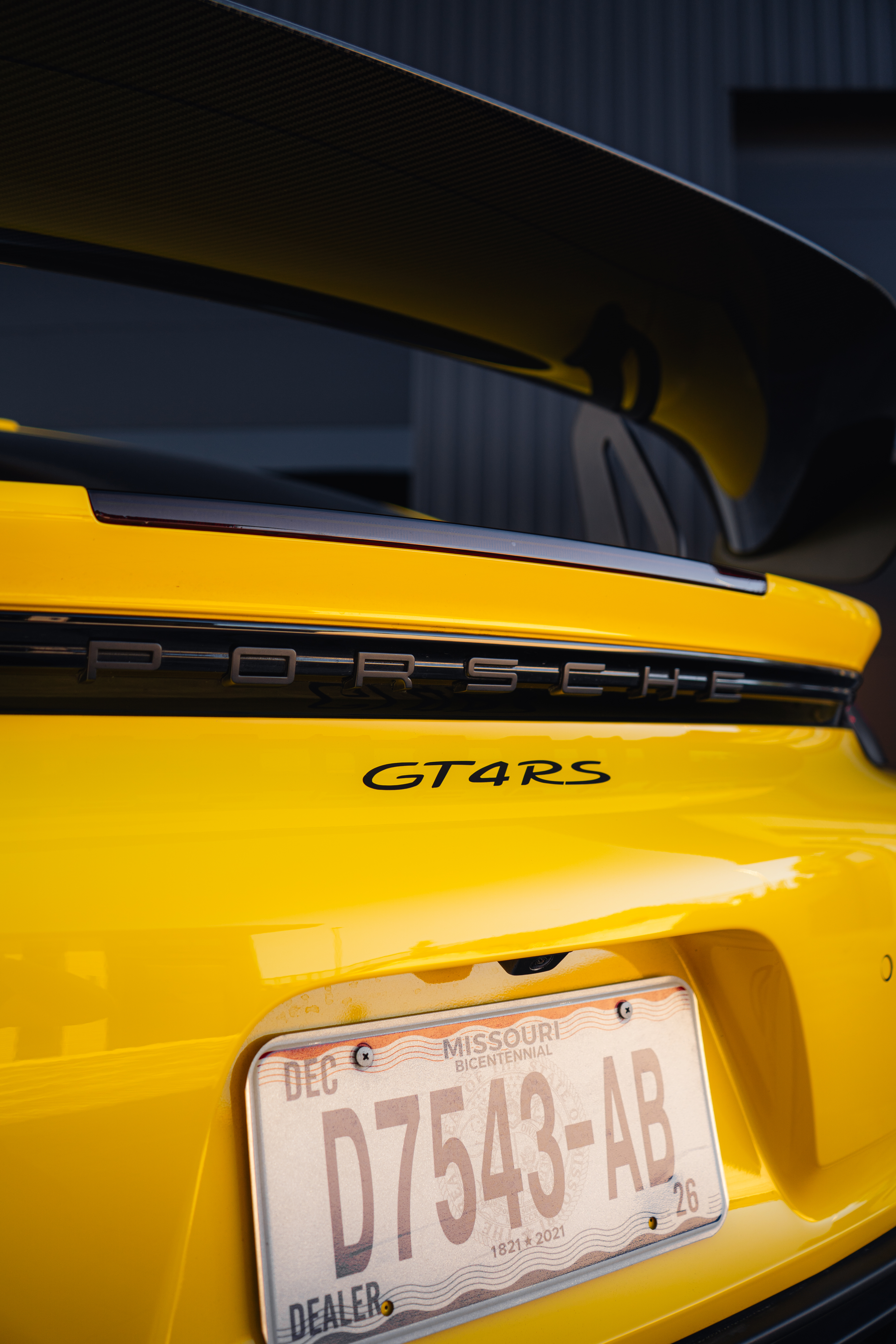 Porsche GT4 RS rear badge and carbon fiber wing closeup