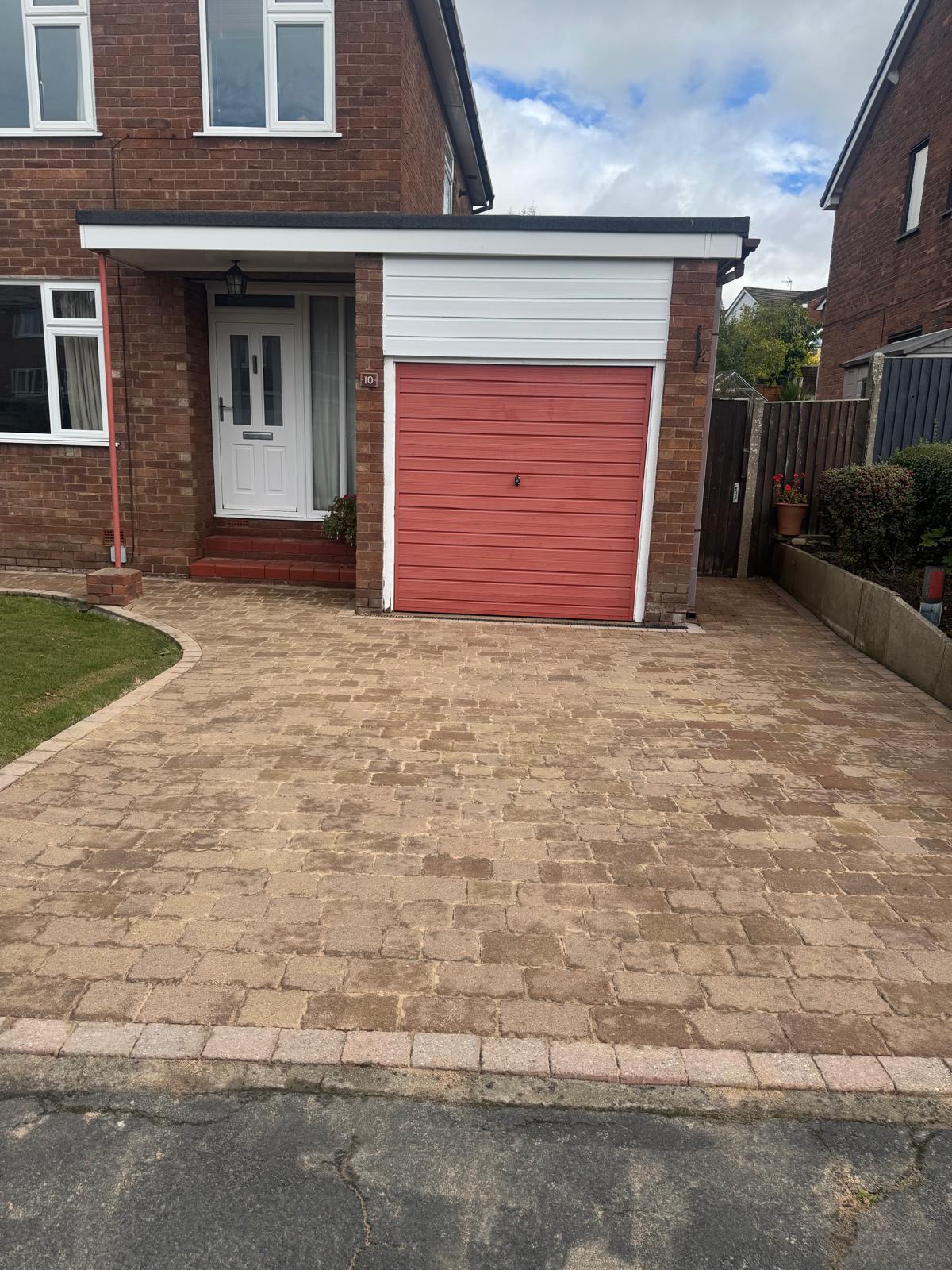 Power washing equipment in action on residential UK property
