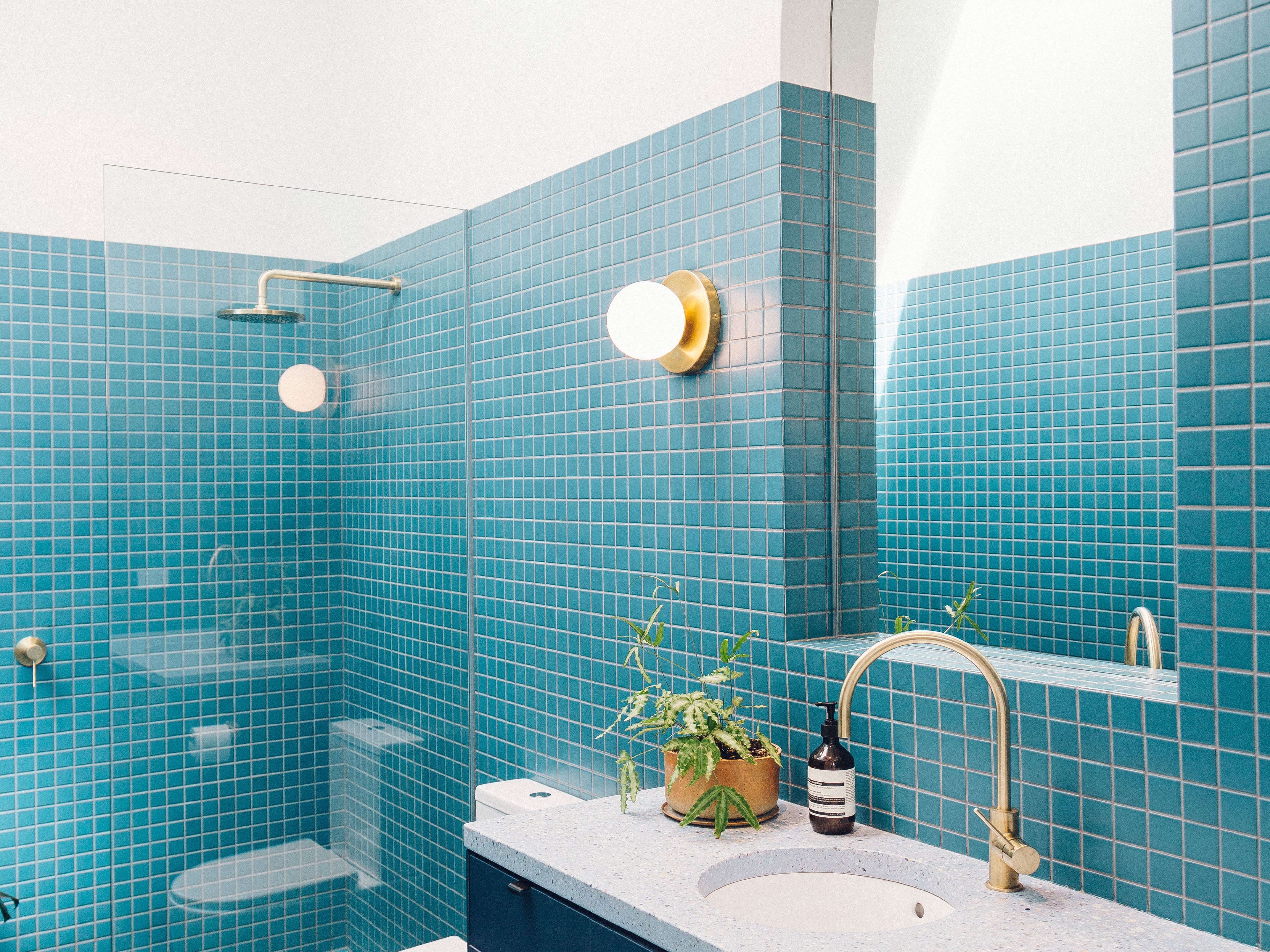 Newly renovated modern bathroom with tiled shower and vanity in Miami