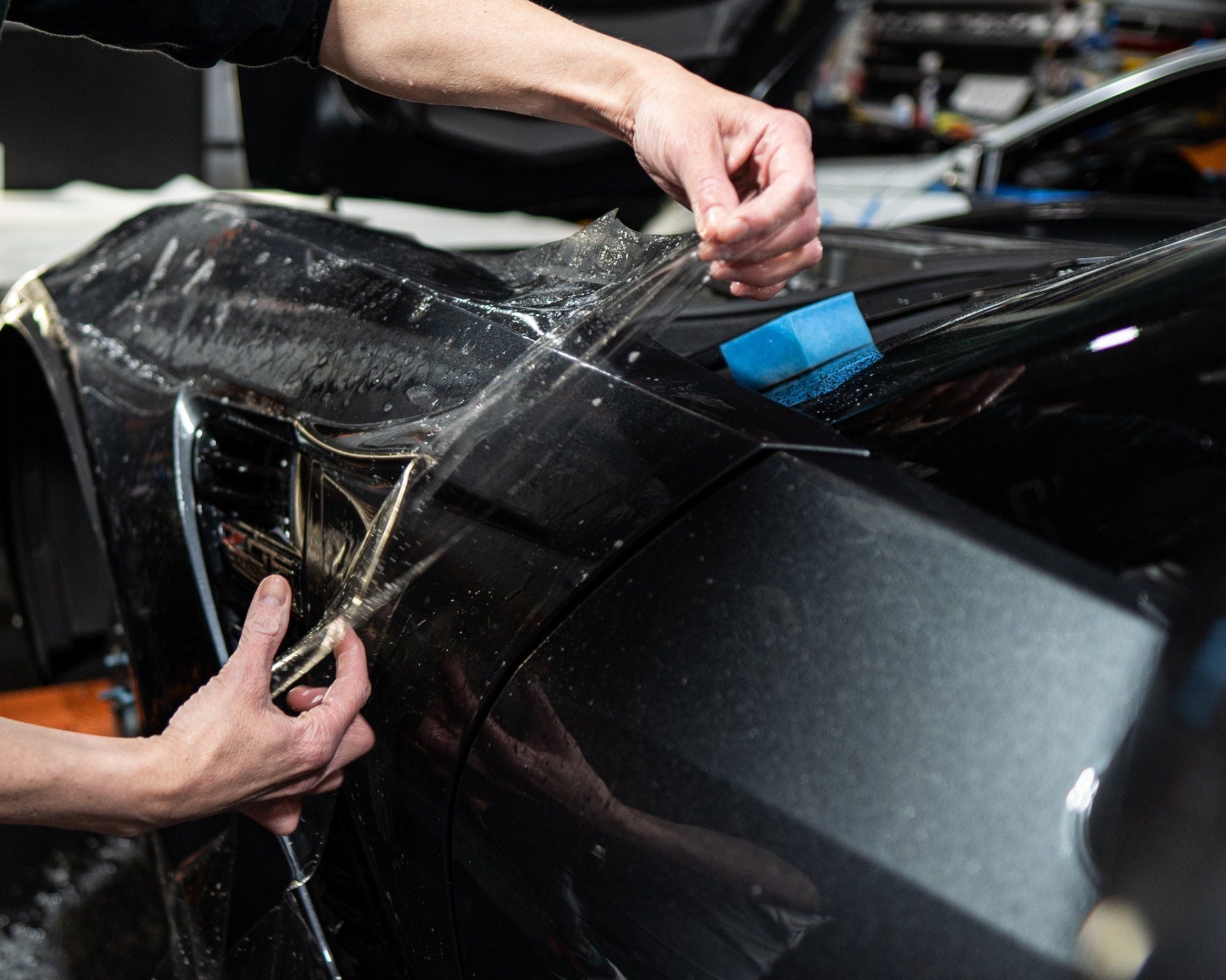 Paint protection film being professionally applied