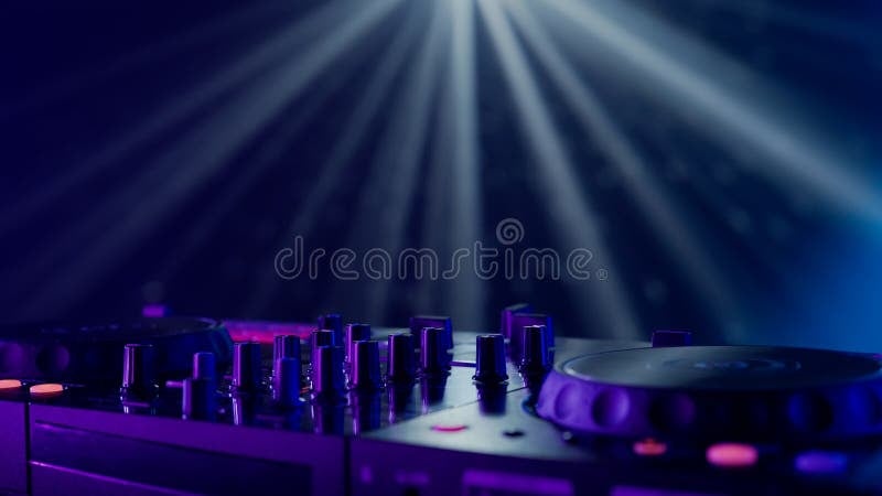 Professional DJ equipment with neon lighting