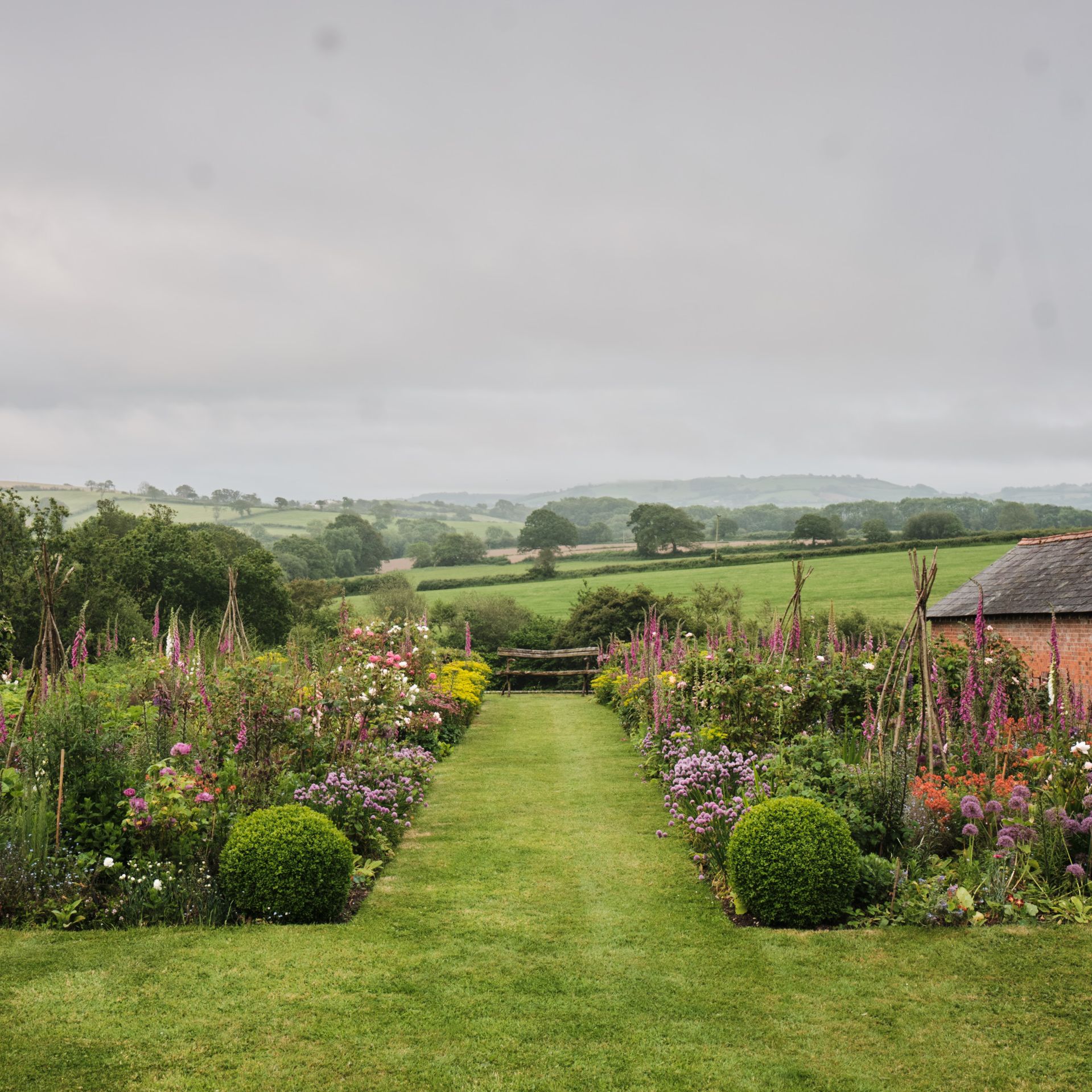 Beautiful British front garden with manicured lawn and hedges