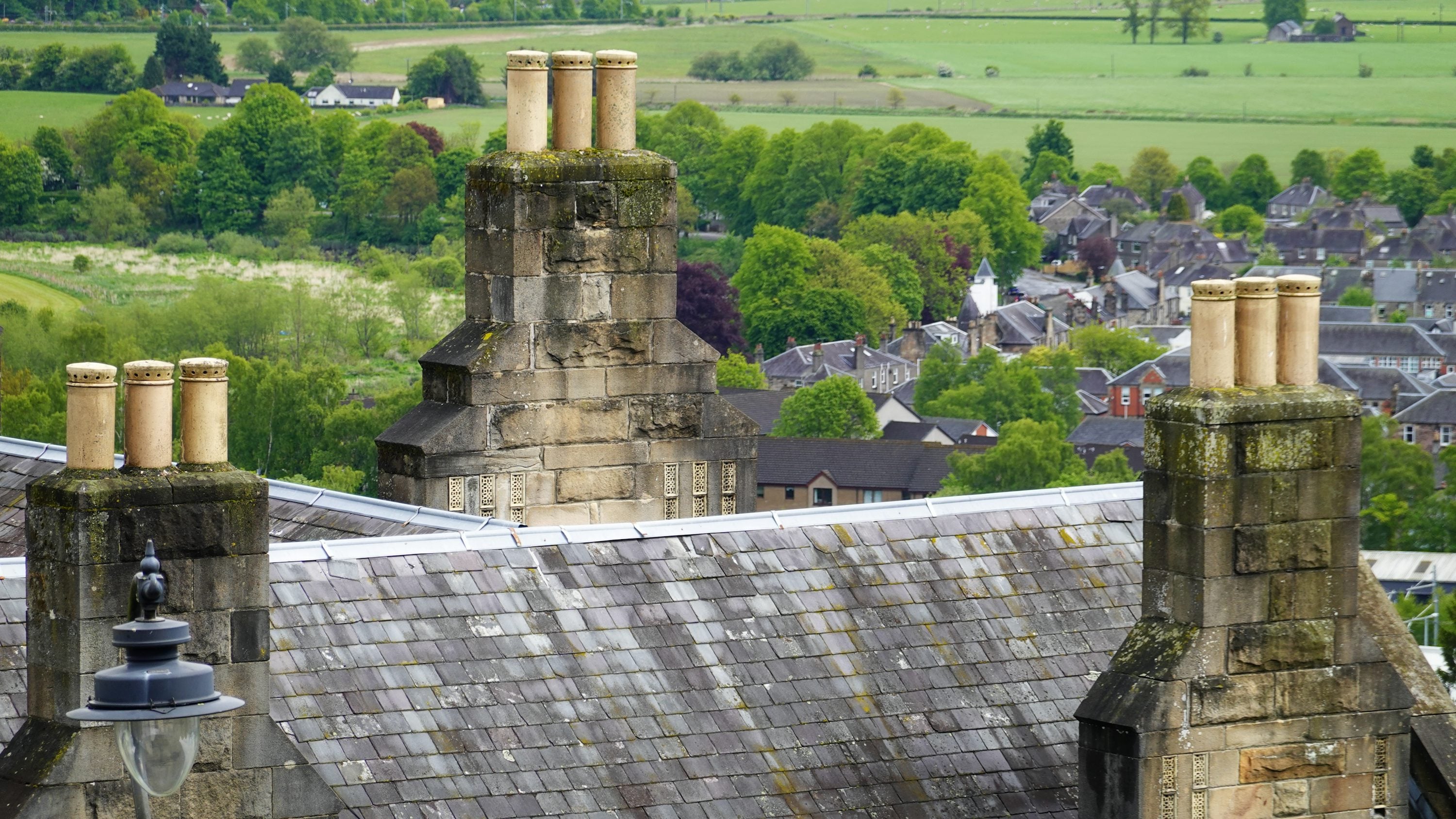 Stone chimneys on a slate roof