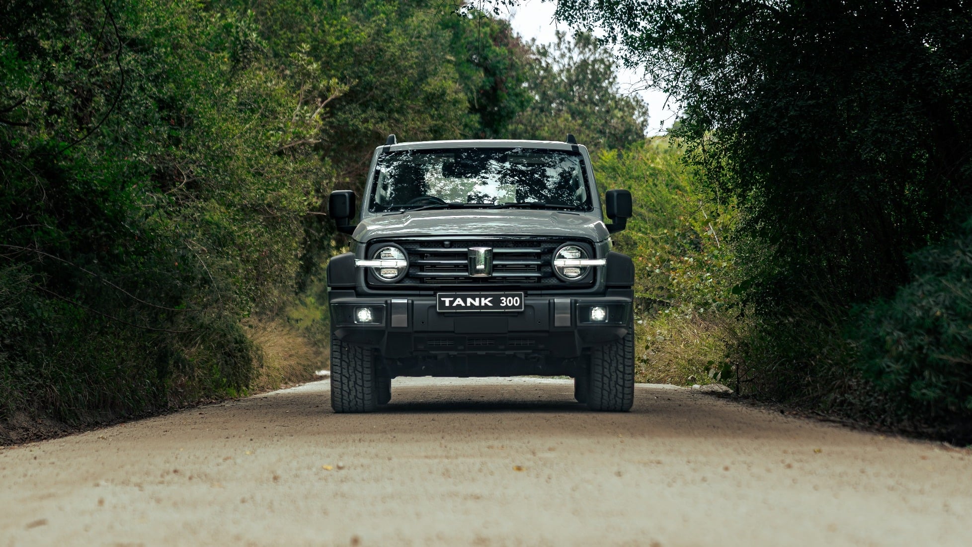 GWM Tank 300 on a gravel road in an off-road adventure setting