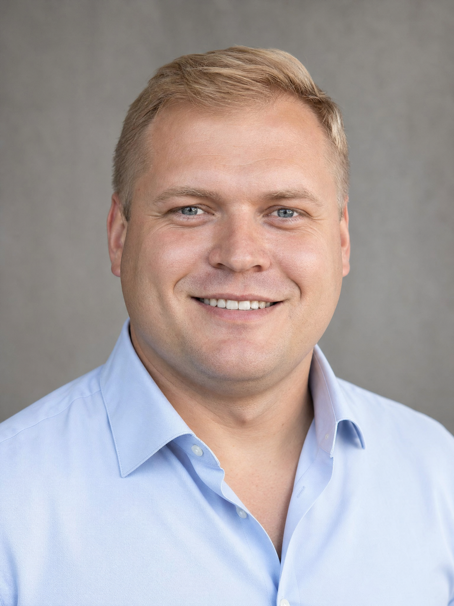 Professional headshot of nominee Bogdan