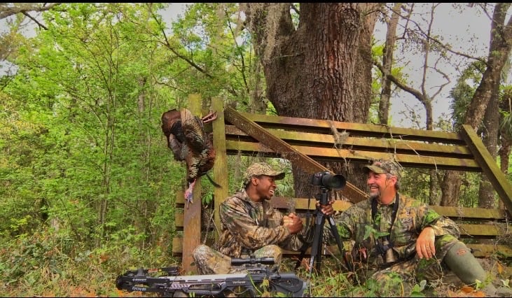 Joshua and friend with a turkey harvest while filming for Son of the South