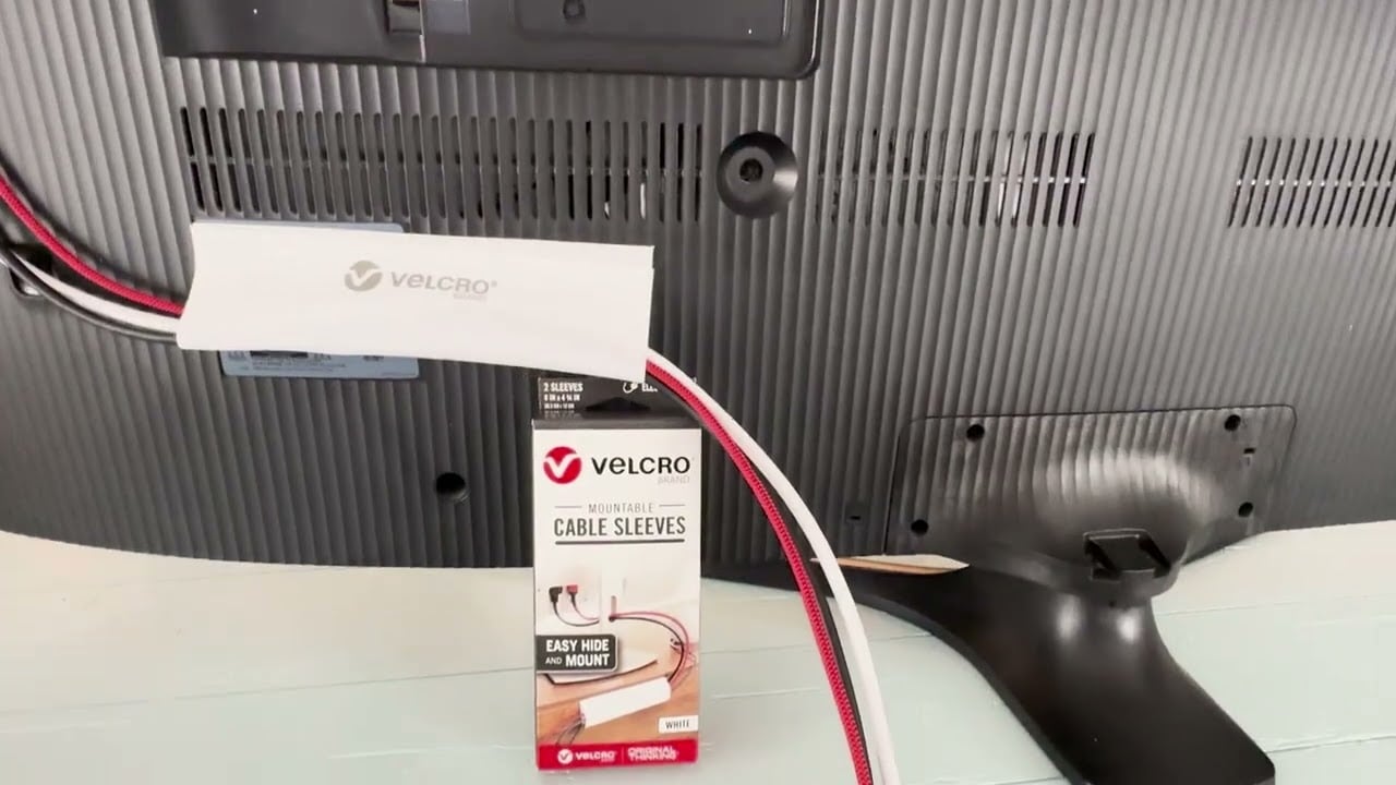 Messy TV wall mount with visible hanging cables