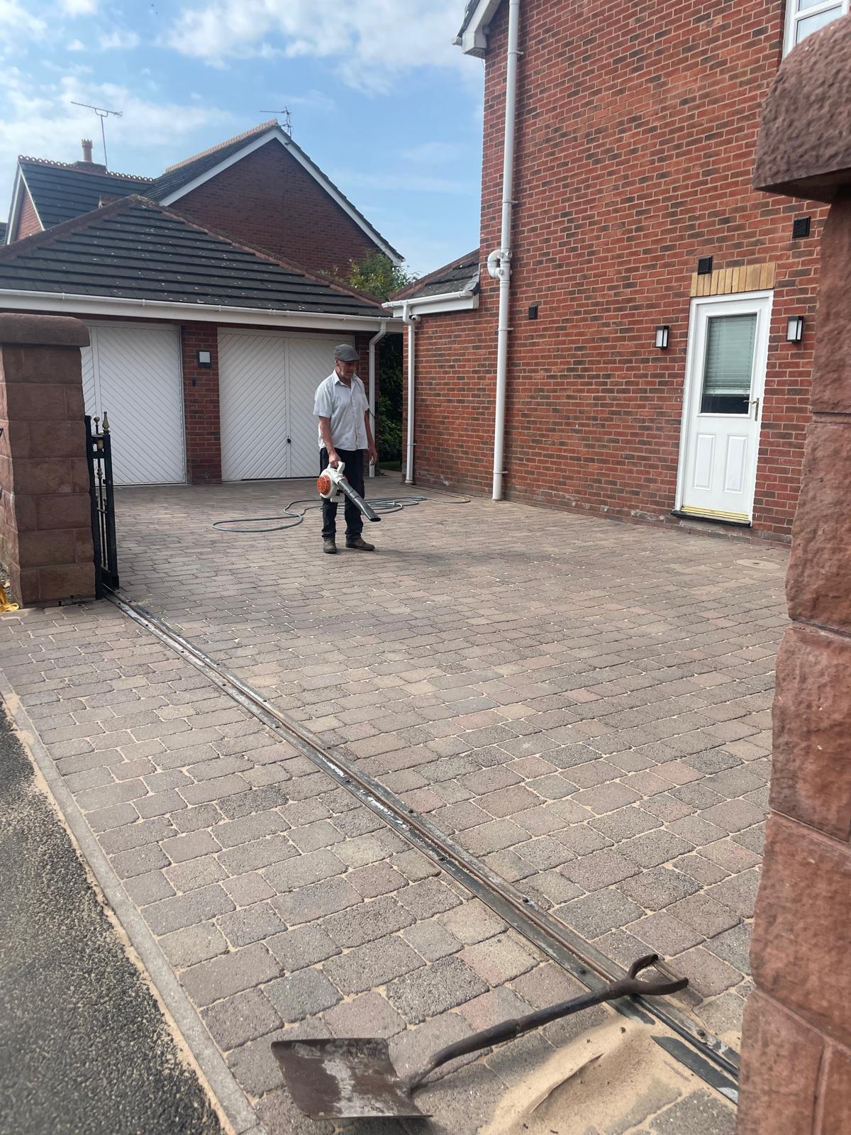 UK residential driveway being pressure washed