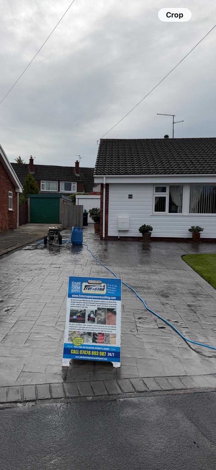 5 Star Super Power Washing branded sign on UK driveway with equipment in use