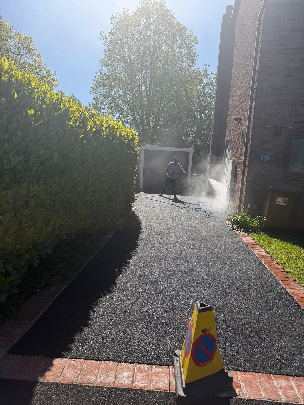 Tarmac driveway before cleaning - green algae and debris