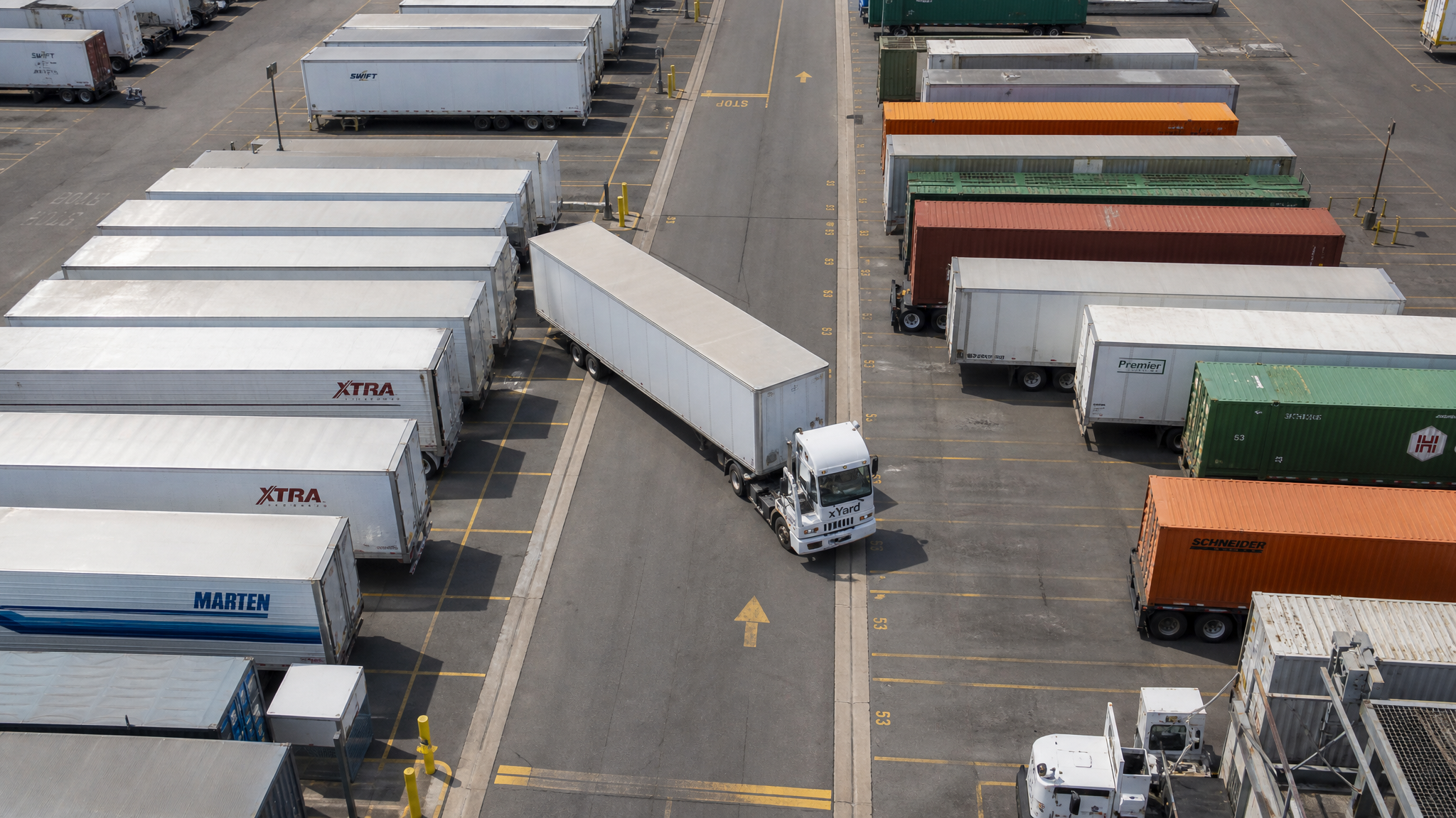Aerial view of xYard logistics yard with organized trailer rows and yard spotter operations