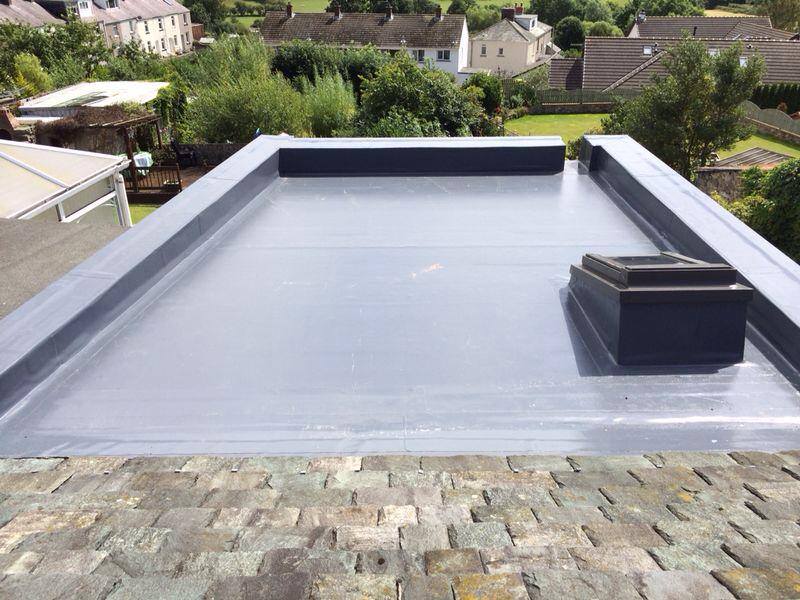 Completed flat roof with trim and drainage