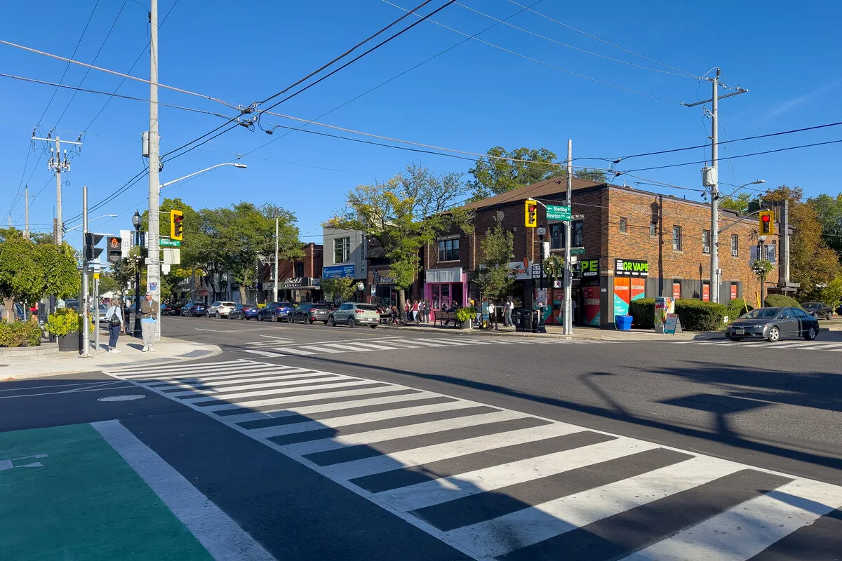Beautiful tree-lined residential street in Westdale Hamilton with heritage homes