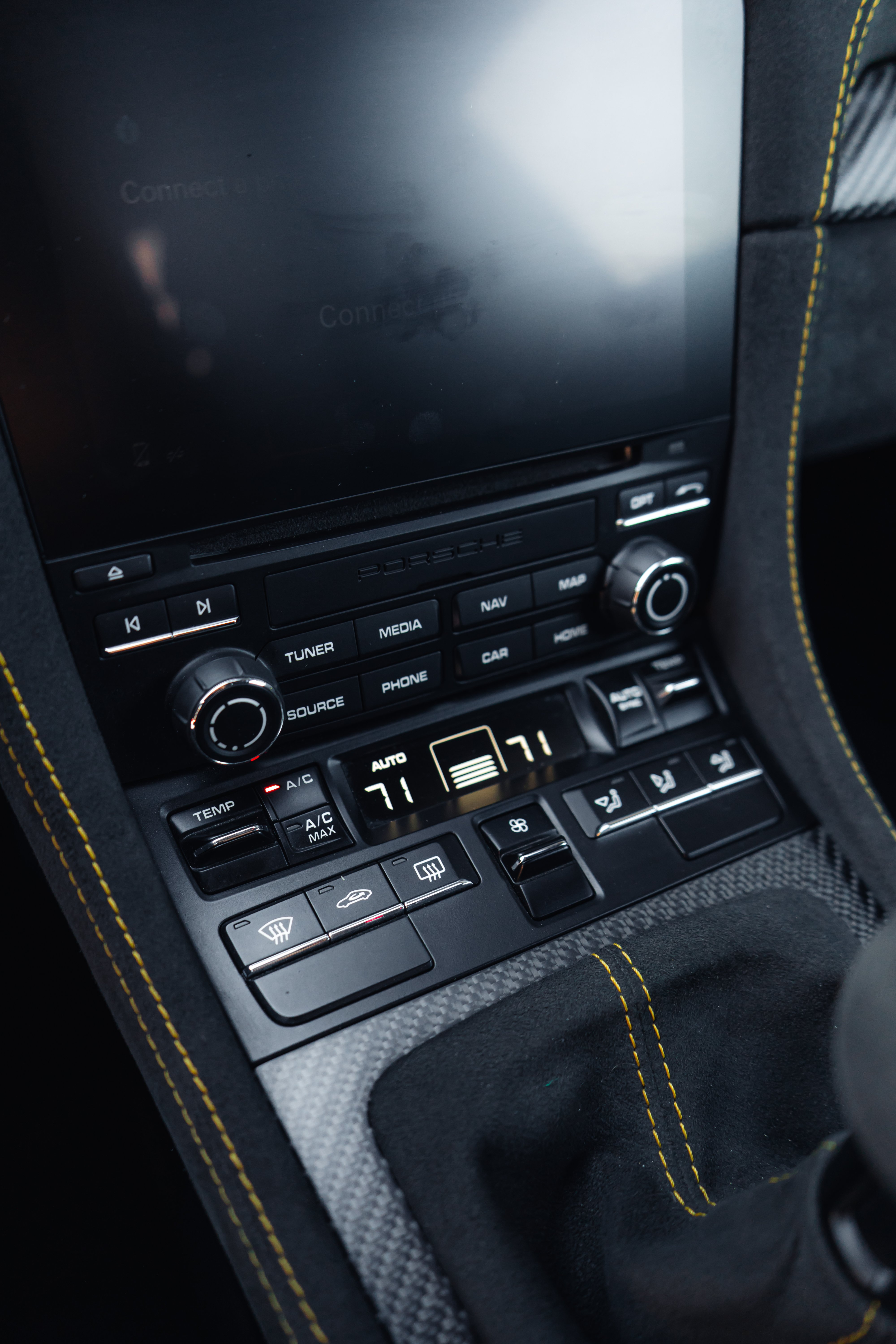 Porsche GT4 RS center console with PCM and yellow contrast stitching