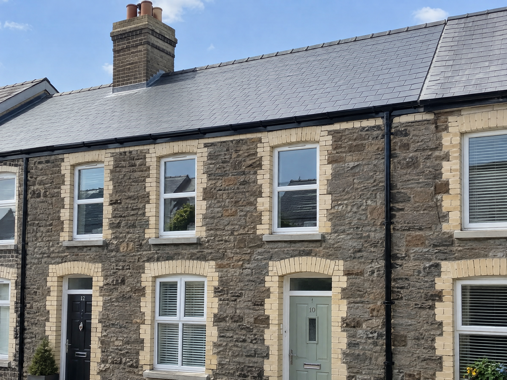 Stone terraced houses with Welsh slate roofs