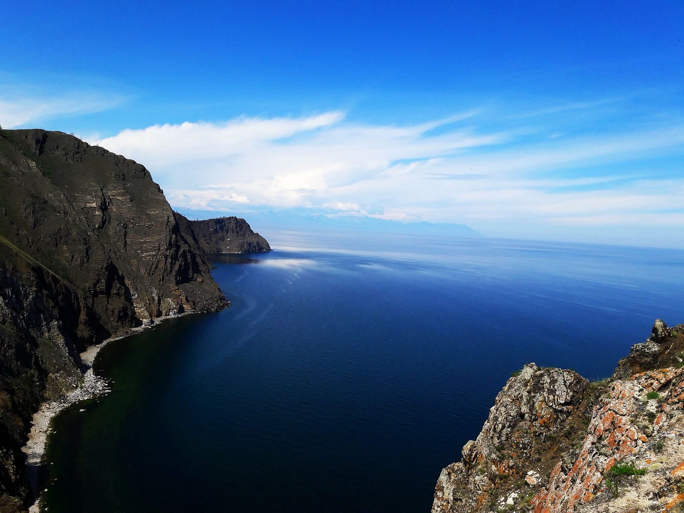 A long deep rift-valley lake between steep shores