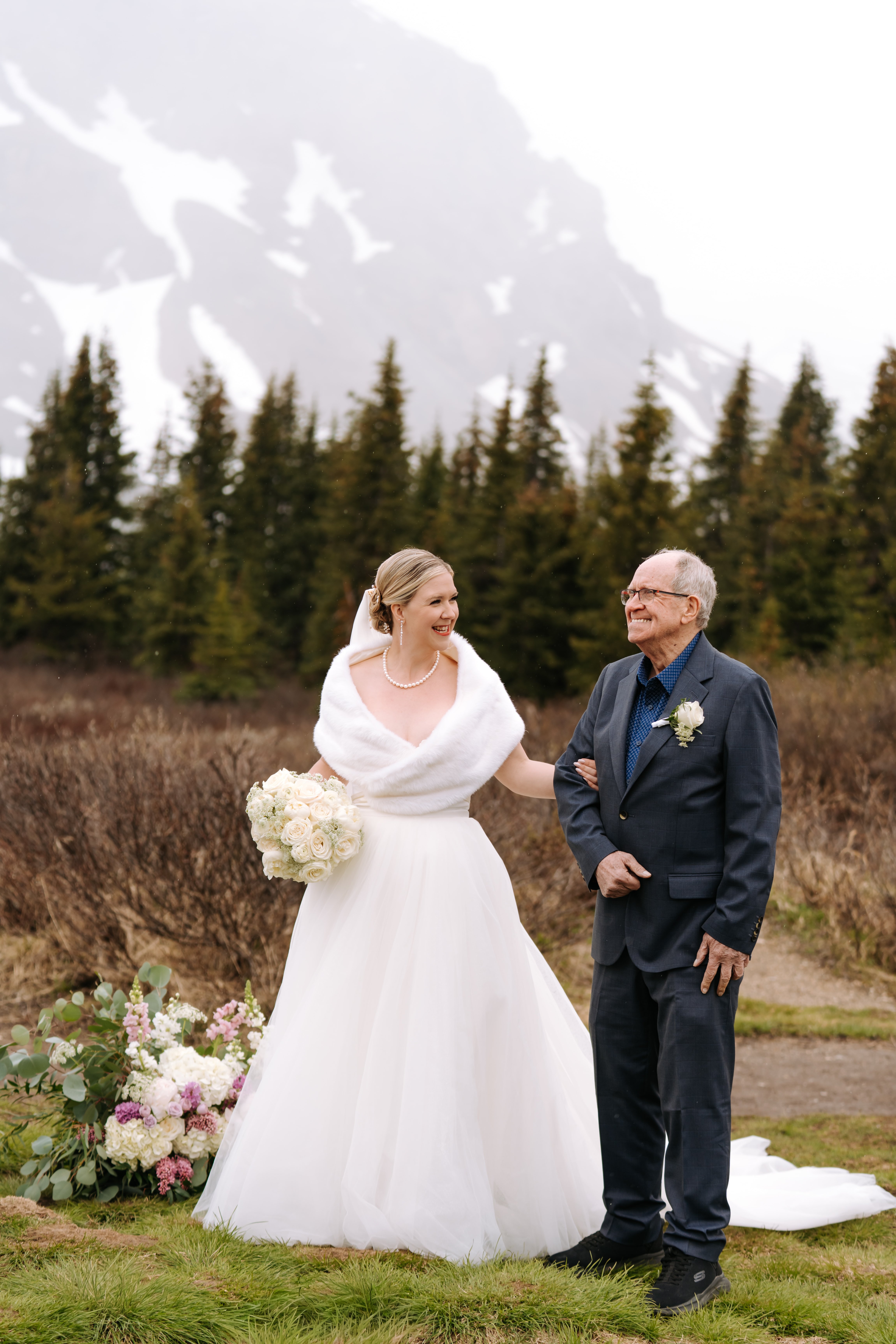 Couple walking together through mountain meadow
