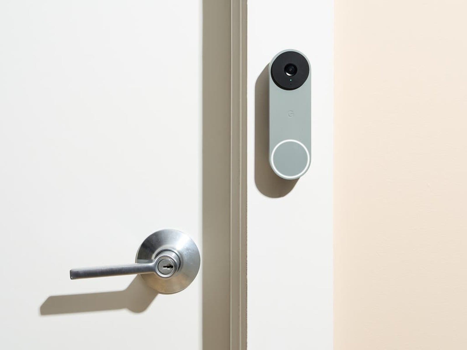 Residential security camera installed near front door of modern Arizona home