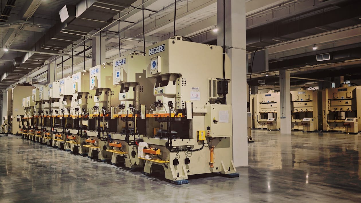 Heavy industrial manufacturing factory floor with machinery